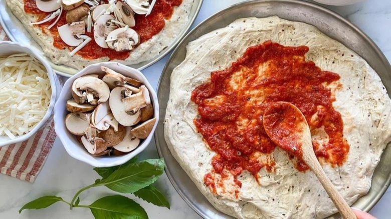 Pizza sauce on dough