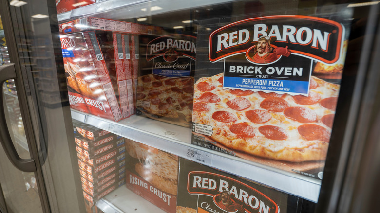 Red Baron frozen pizzas beside DiGiorno frozen pizzas in a grocery store display