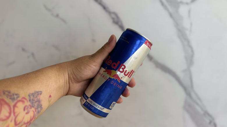original Red Bull held aloft