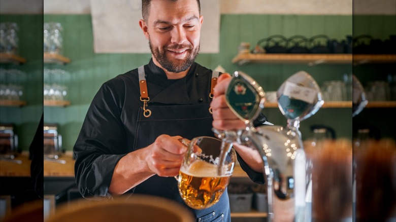 Bartender pulling a pint at a brewery