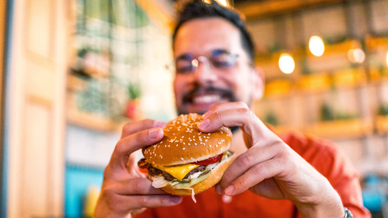 A man eating a cheeseburger