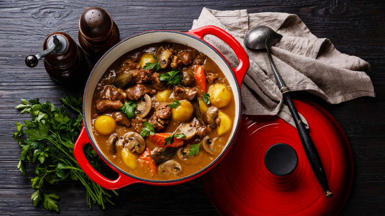 beef stew in a bowl with potatoes and mushrooms