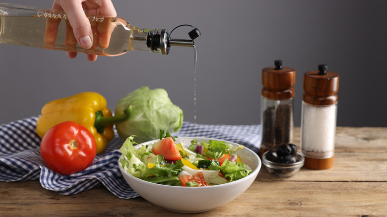 dressing poured onto salad