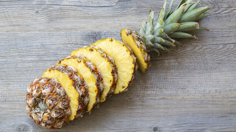 Cut pineapple on a wooden surface