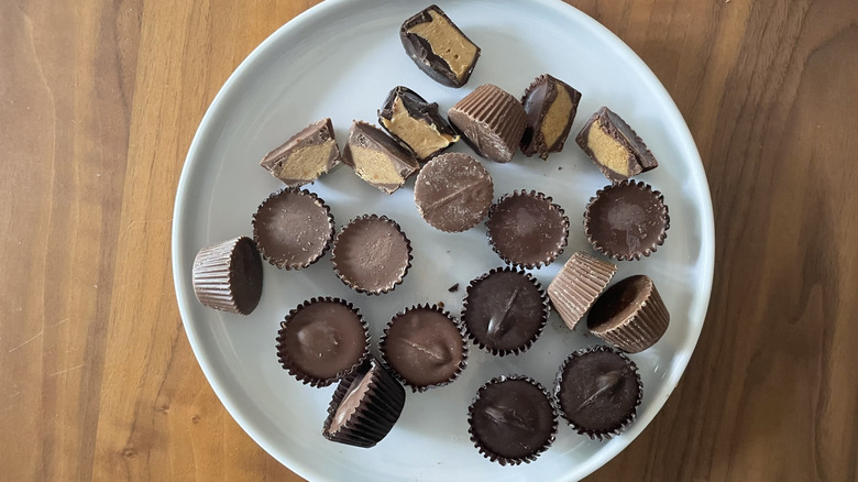 Assorted unwrapped peanut butter cups on a plate