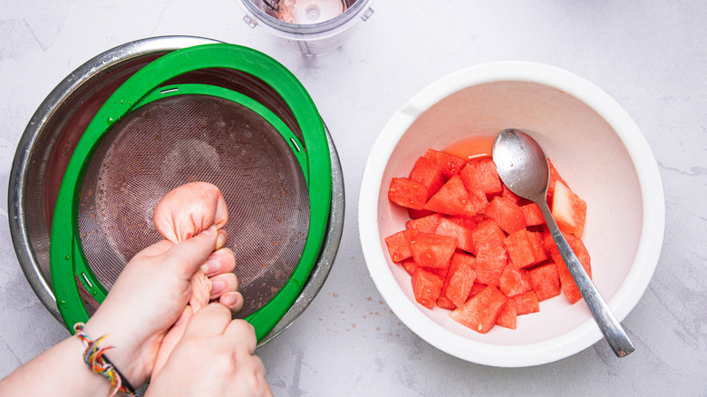 Straining watermelon juice.
