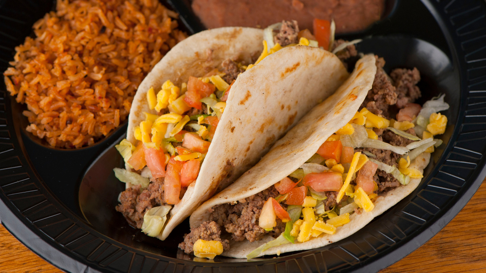 Refried Beans Are The Flavorful Filling To Bulk Up Your Beef Tacos