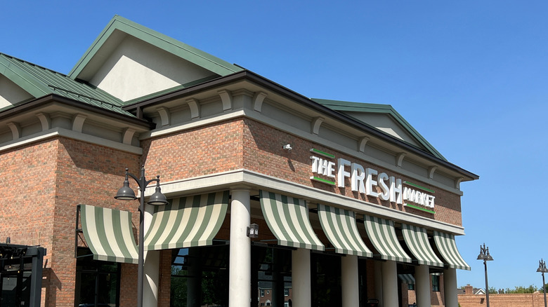 The Fresh Market exterior with a blue sky behind it