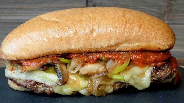 Cudighi sandwich with cheese, marinara, onions, and peppers