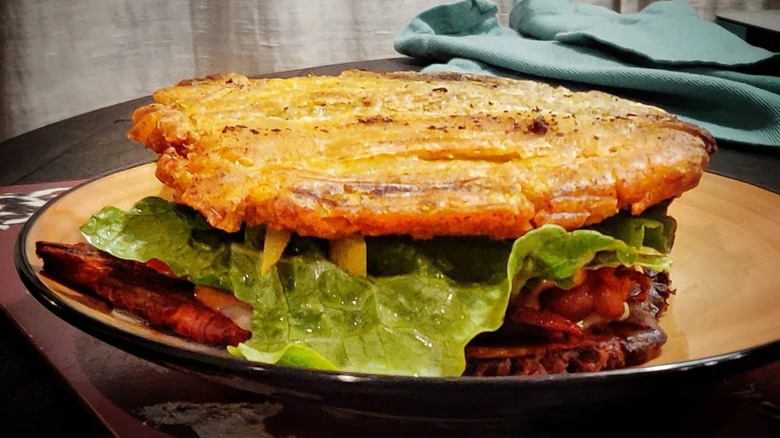 Homemade Jibarito sandwich with lettuce on plate