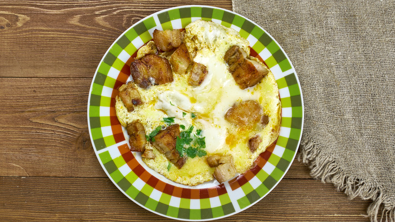 Hangtown fry served on green and white checkered plate