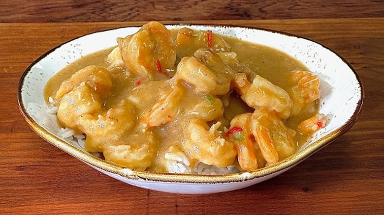 Étouffée stew served over rice in white bowl