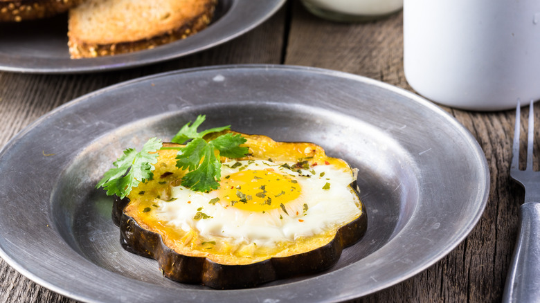 Egg-in-a-hole made with acorn squash slice