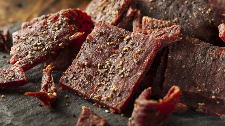 Pieces of beef jerky seasoned with ground pepper
