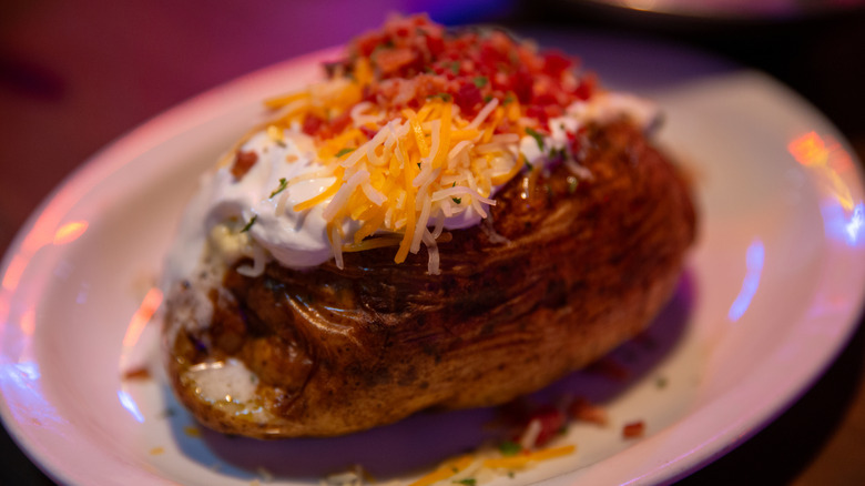 loaded baked potato with sour cream cheese and bacon