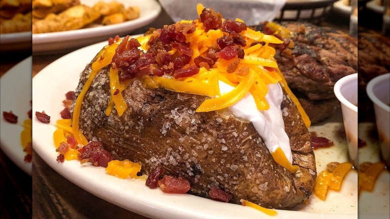 Texas Roadhouse loaded baked potato with sour cream cheese and bacon