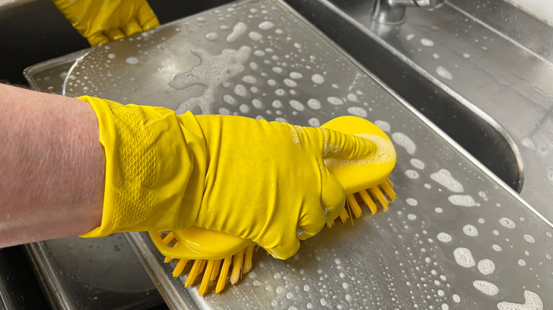 cleaning a baking tray before use