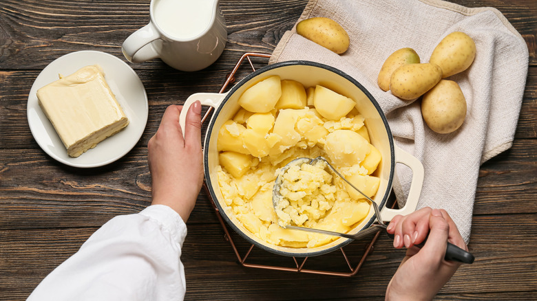 Woman cooking mashed potatoes