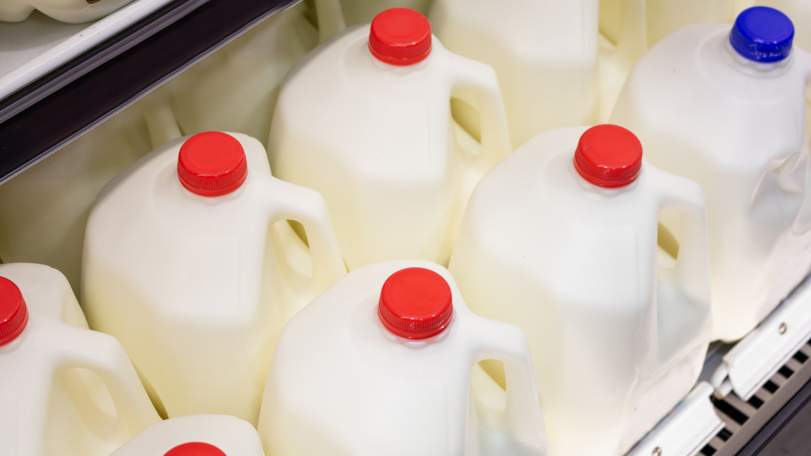 Repurpose A Milk Jug Into Decorative Countertop Storage With Clothespins And Glue
