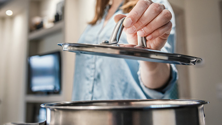 Don't Toss Old Pan Lids — Give Them A Second Life As Stylish Kitchen Hooks