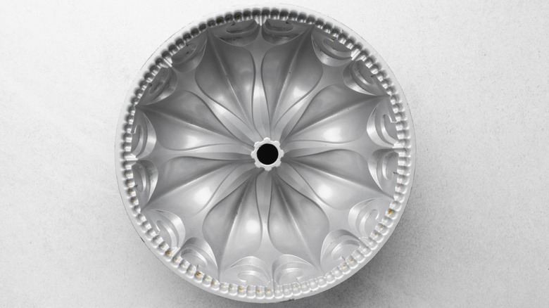 A bird's eye view of an ornate silver bundt cake pan