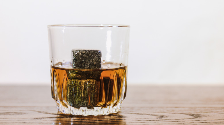 Glass of whiskey with whiskey stones