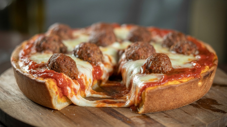 Chicago-style deep dish pizza on a cutting board