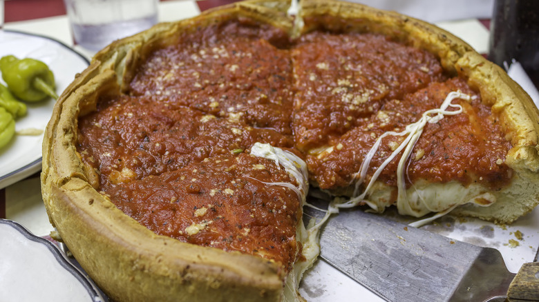 Closeup of Chicago-style deep dish pizza on a table