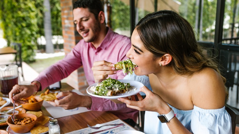 Two people eating in restaurant