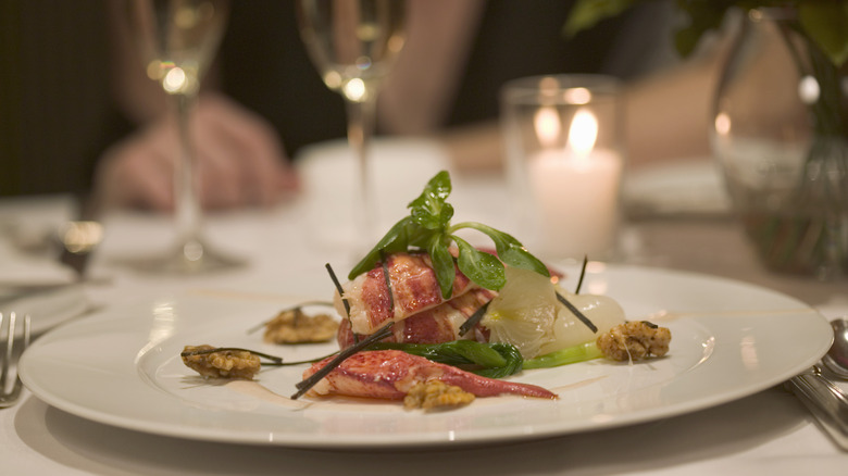 Complicated gourmet dish on white plate