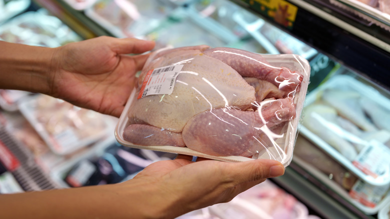 person shopping for chicken