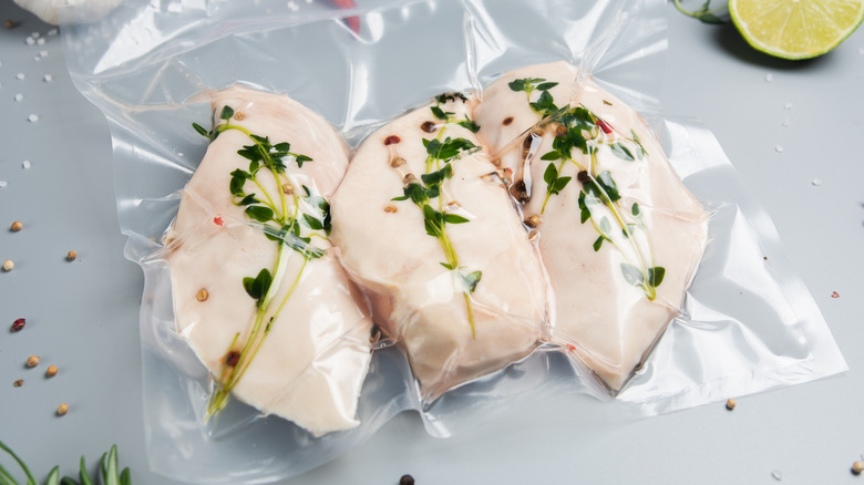 Vacuum-packed chicken fillets sous vide