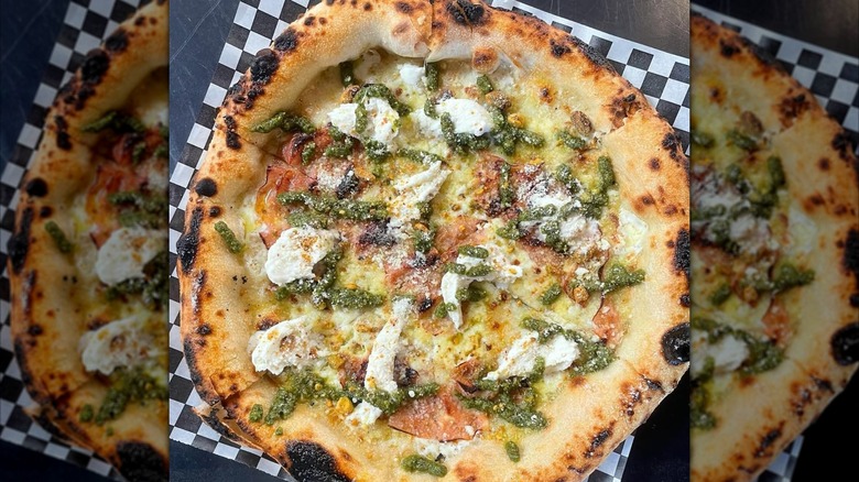Pesto pizza on checkered paper