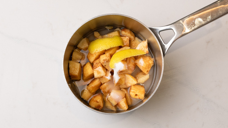quince cardamom syrup ingredients in pan