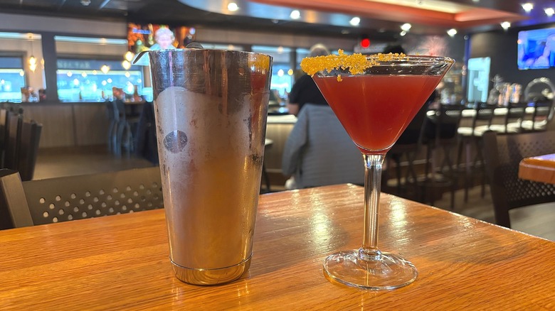 Applebee's Rollin' on the Beach cocktail next to shaker on table in restaurant