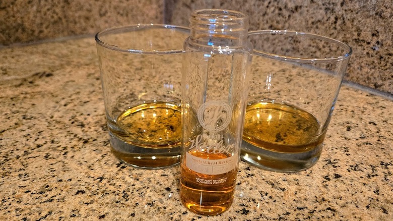 Two glasses and sample bottle of Weller Spelt bourbon.