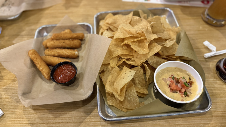 Buffalo Wild Wings bottomless apps with mozzarella sticks and chips and queso.