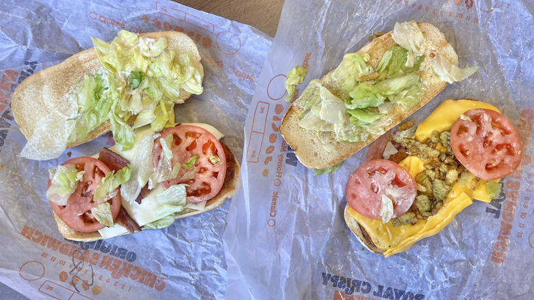 Top view of two sandwiches on paper wrappers