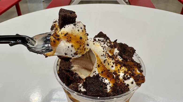 Costco Caramel Brownie Sundae with spoonful being scooped out