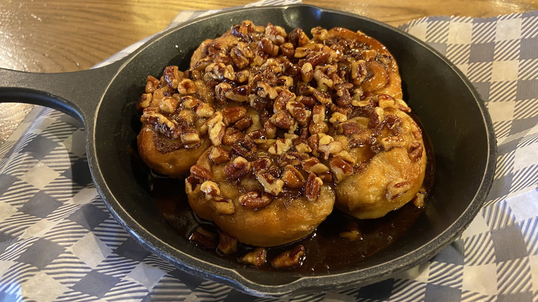 Small pan containing five pecan-topped sticky buns