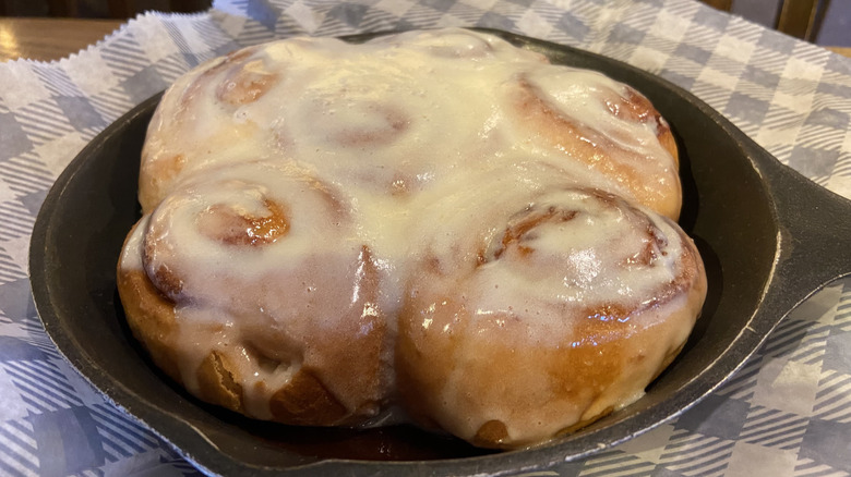 Small pan containing five cinnamon rolls