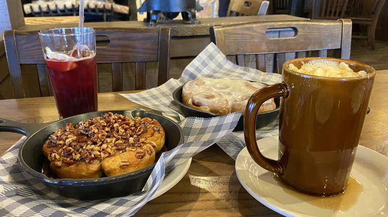 Tea, sticky buns, cinnamon rolls, and latte