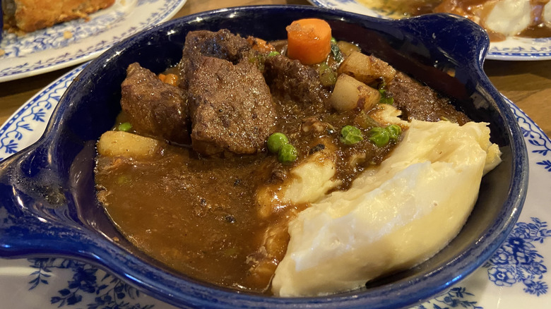 Blue ceramic dish of pot roast