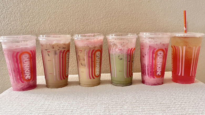 Dunkin' drinks lined up on a table
