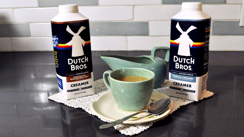 Dutch Bros creamers with a cup of coffee