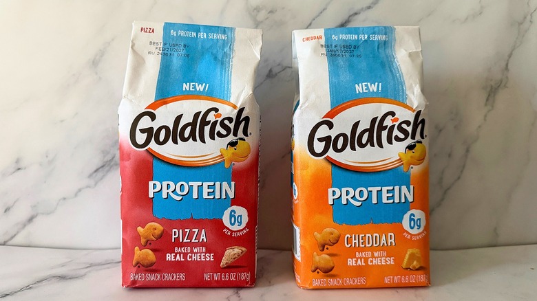 Two bags of Goldfish side-by-side on marble background