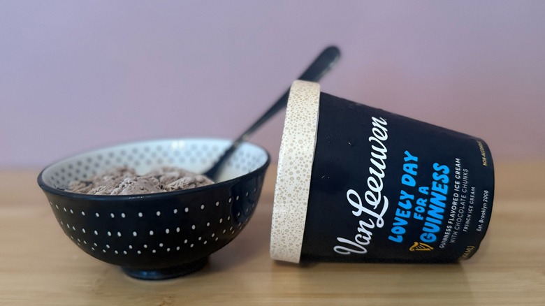 bowl of ice cream with pint of Van Leeuwen Lovely Day For A Guinness laying on its side next to it