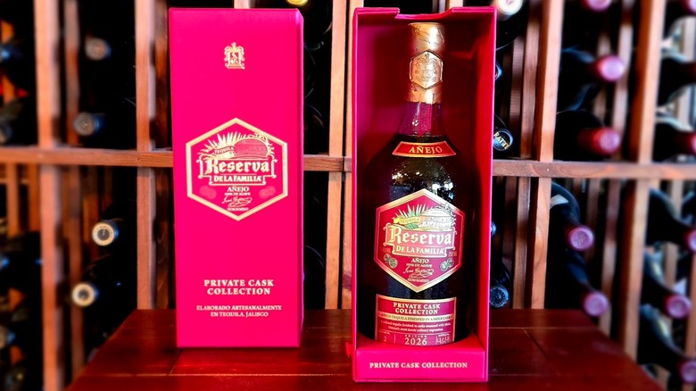 Bottle of Reserva de la Familia Private Cask Edition No. 2: Mole Edition and box in front of a wine rack