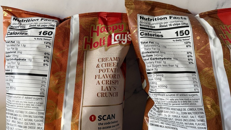 Nutrition labels on the back of two bags of Lay's Holiday chips