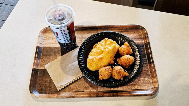 Long John tray with Silver's Chicken Tenders and soda